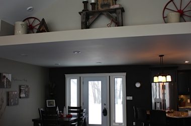 Dining room with view of decorative shelf above living room/diningroom